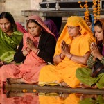 senior women perform puja - ritual ceremony at holy Pushkar town