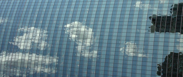 skyscraper-with-clouds-in-background